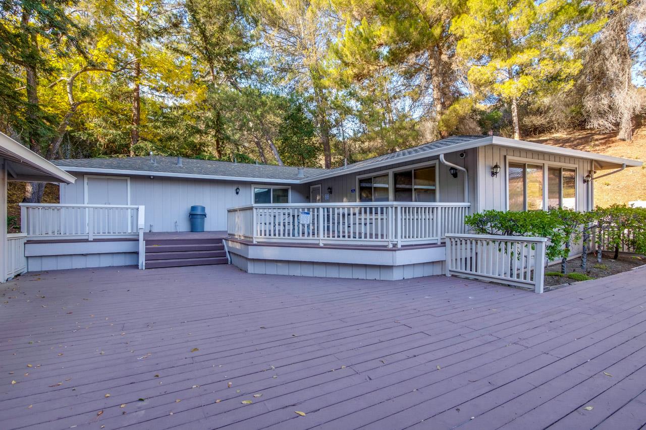 22903 Longdown Road Cupertino, CA 95014 - Photo 32 of 42 a view of backyard of house with wooden deck and large trees