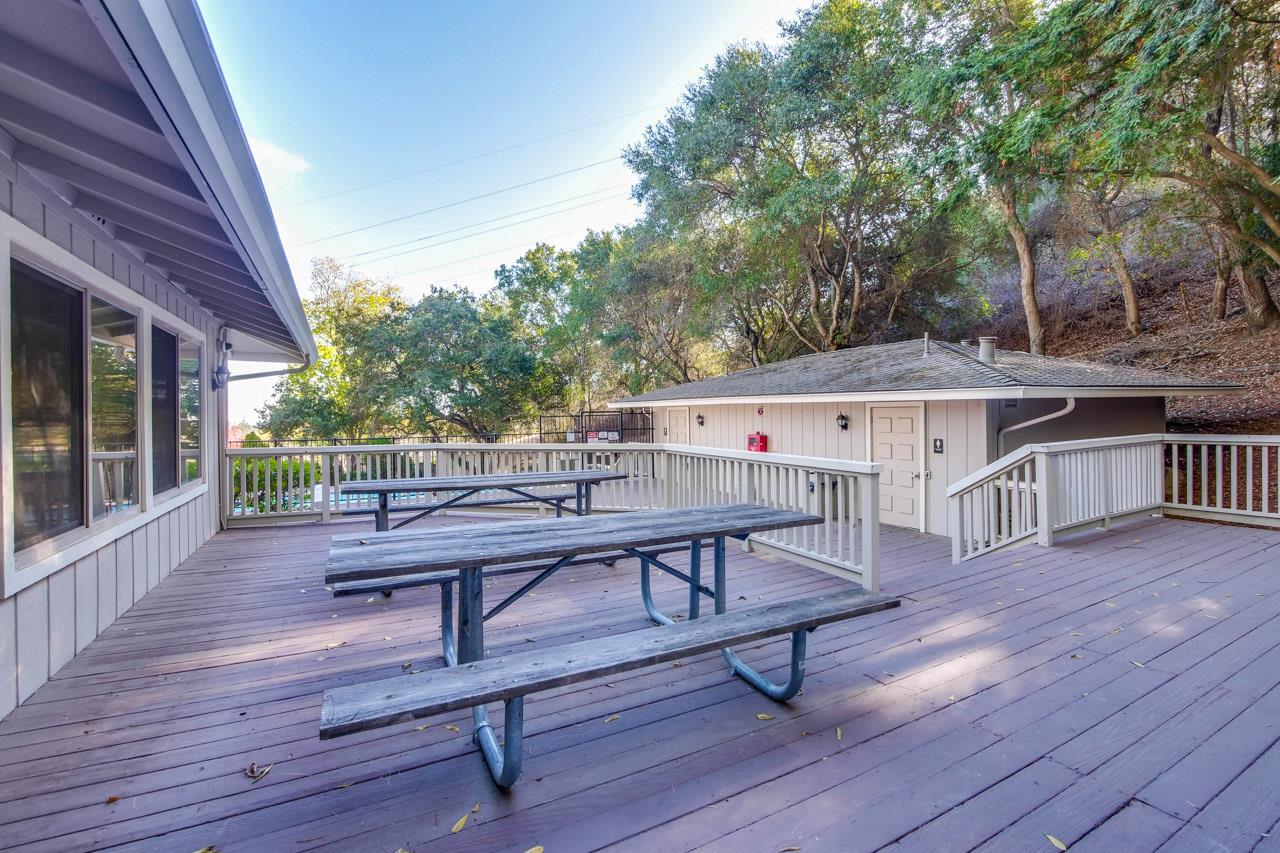 22903 Longdown Road Cupertino, CA 95014 - Photo 33 of 42 a view of a deck with table and chairs and wooden floor