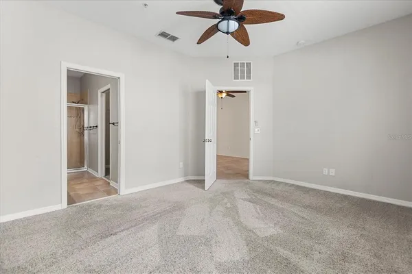 a bathroom with a double vanity sink toilet and shower