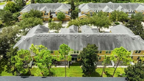 an aerial view of a house with outdoor space