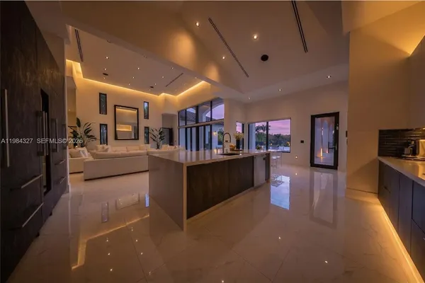 a spacious bedroom with a bed and a view of closet
