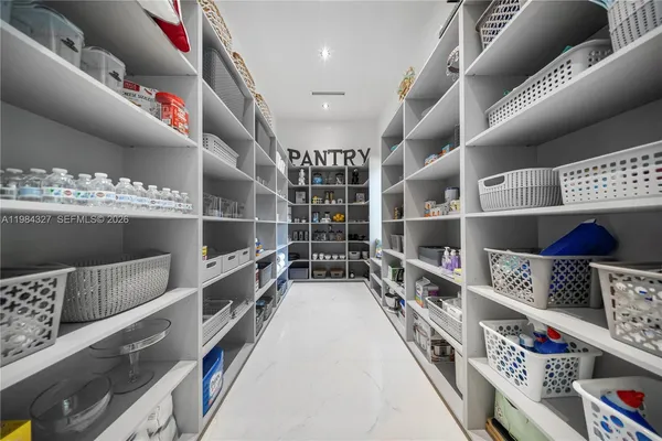 a bedroom with a bed window and couch