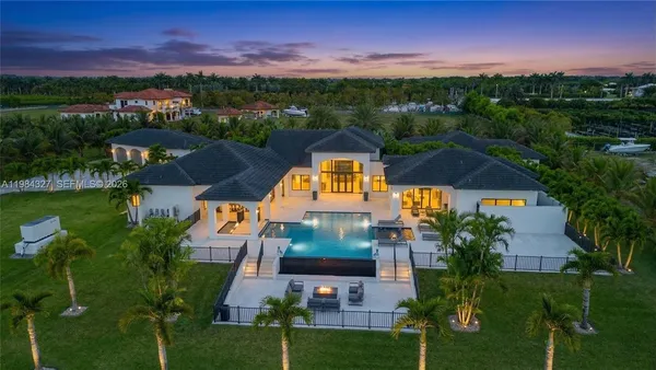 a view of an entryway with a flower pot and windows