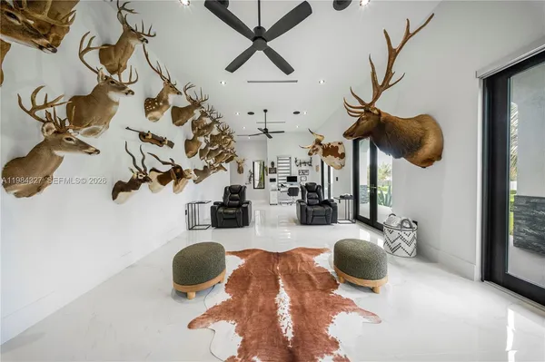 a spacious bedroom with a bed and a chandelier