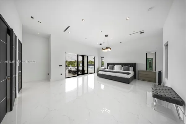 a bathroom with a granite countertop shower and a sink