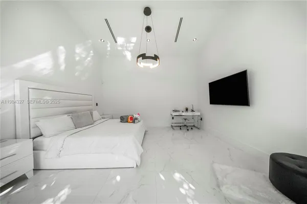a view of a hallway with wooden floor and a hallway