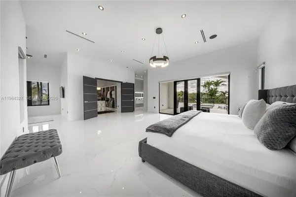 a kitchen with refrigerator and cabinets