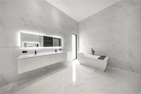 a view of a chairs and tables in a patio