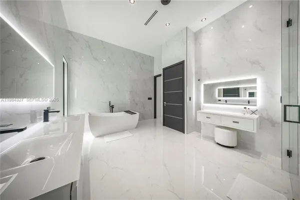 a view of a house with swimming pool and sitting area