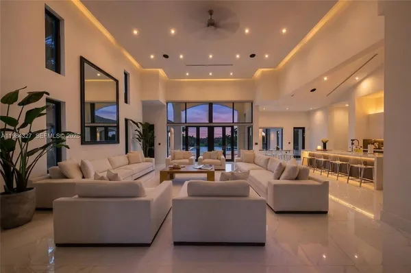 a view of a livingroom with furniture and a flat screen tv