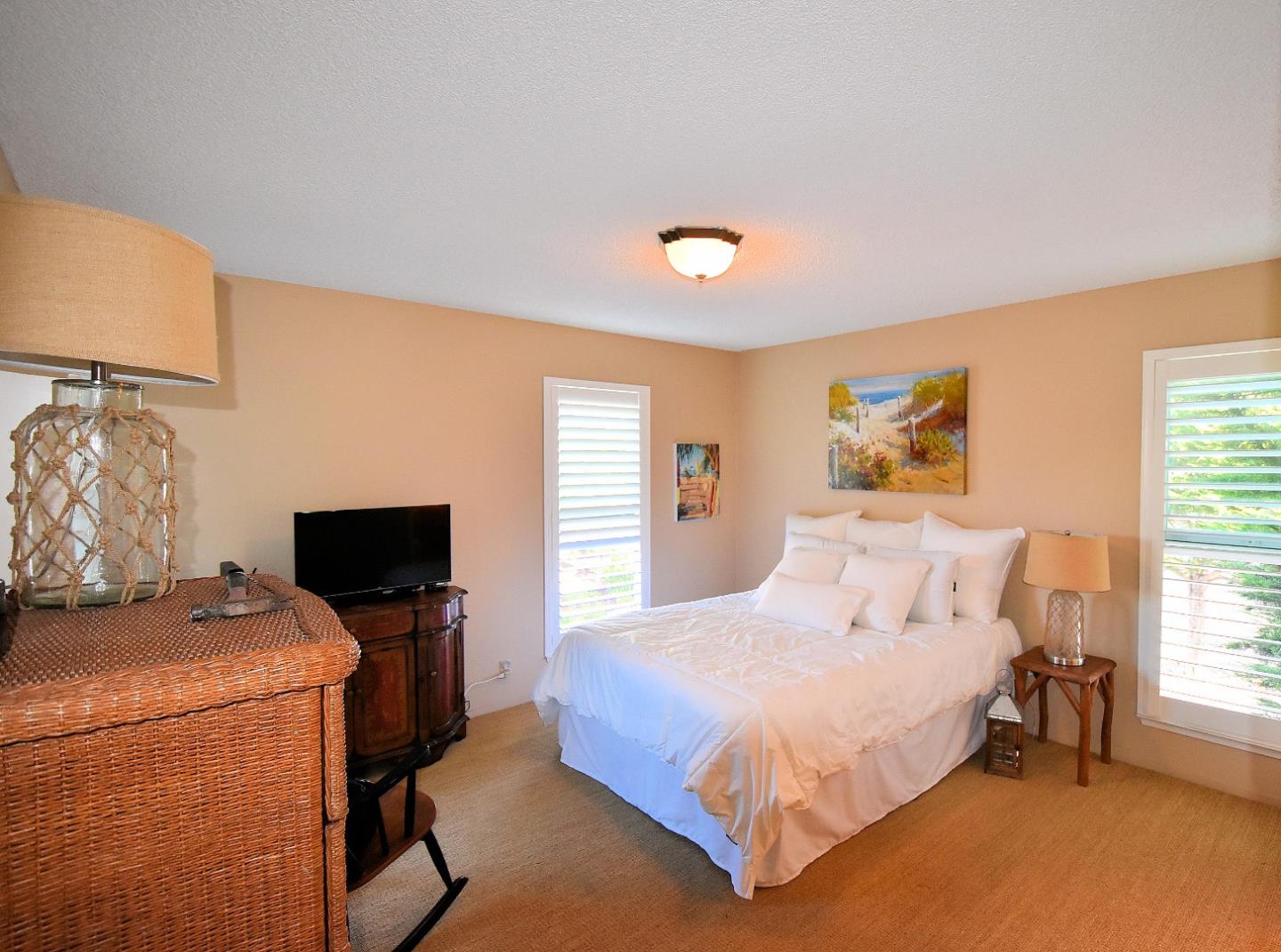 917 Vía Tornasol Aptos, CA 95003 - Photo 8 of 20 a bedroom with a bed and a tv