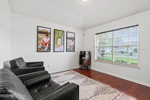 a living room with furniture and a window