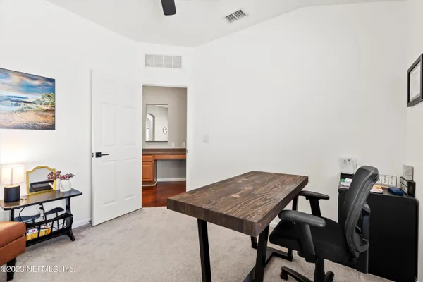 a view of a workspace with furniture