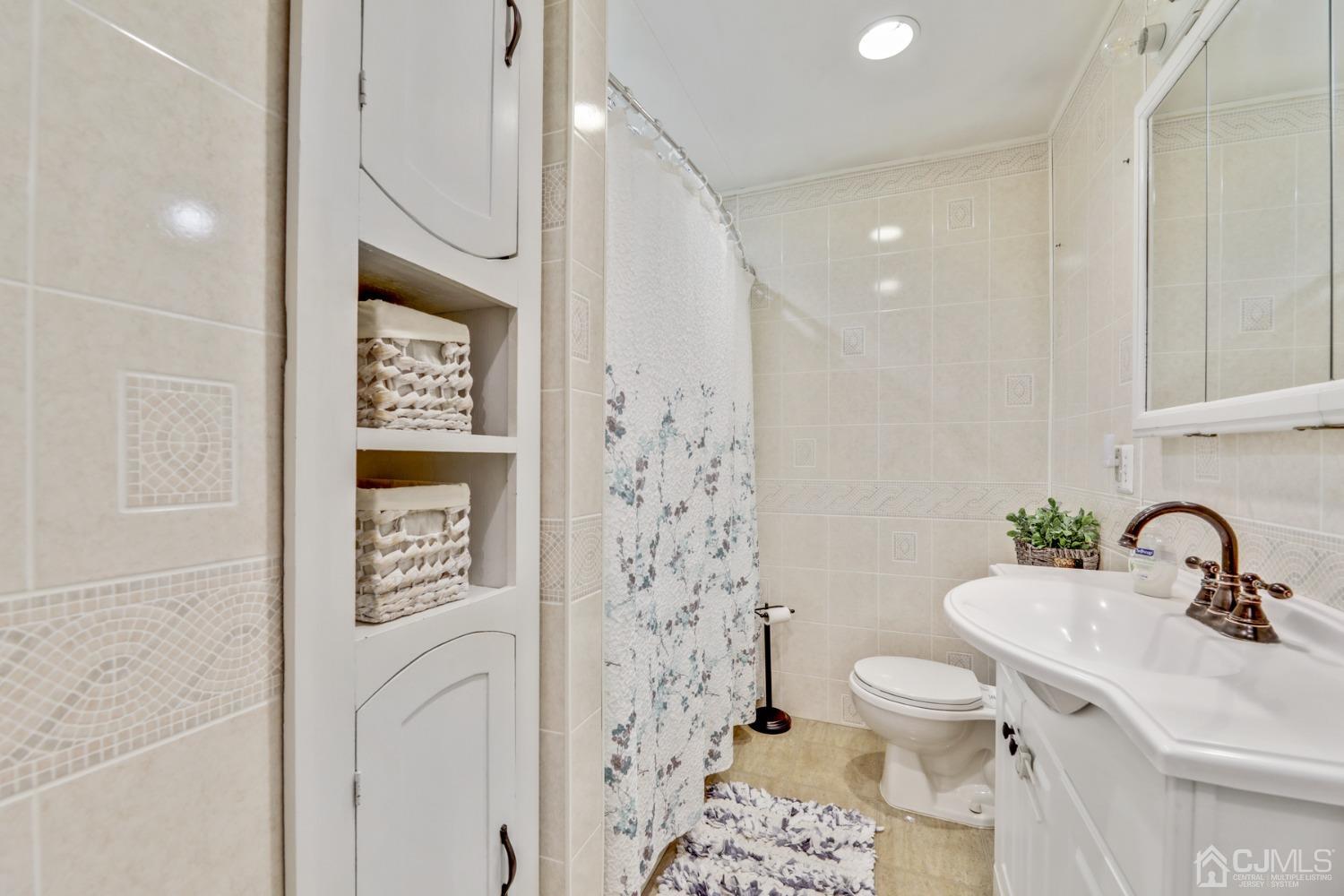 199 Jordan Road Colonia, NJ 07067 - Photo 13 of 24 a bathroom with a sink toilet and shower
