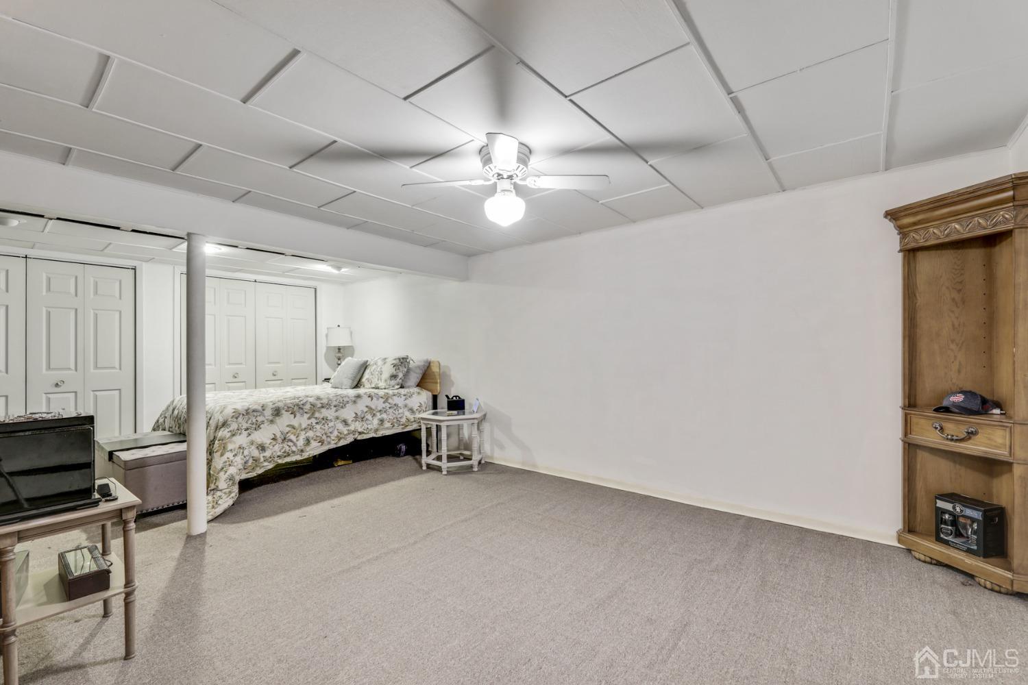 199 Jordan Road Colonia, NJ 07067 - Photo 17 of 24 a bedroom with bed and a chandelier