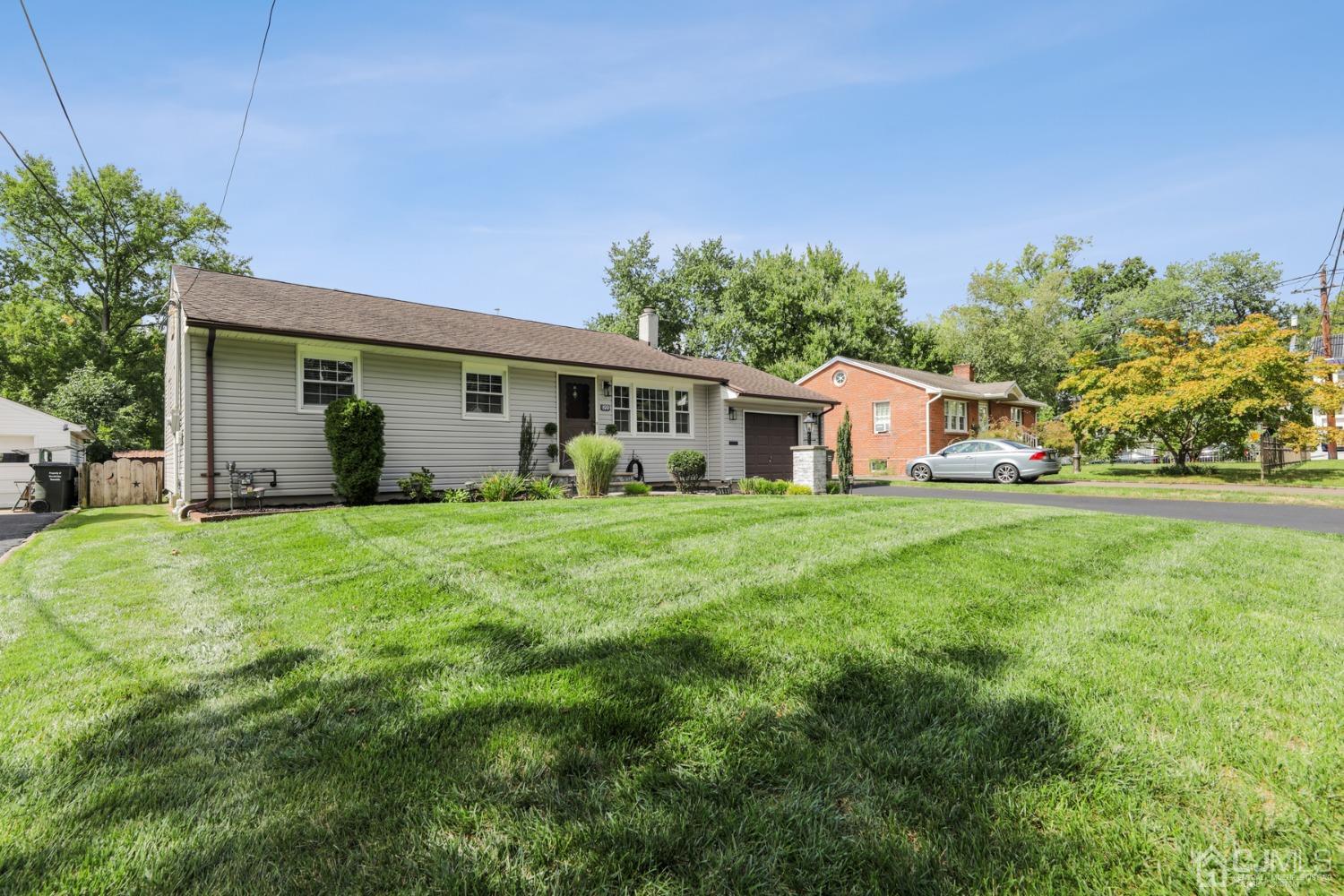 199 Jordan Road Colonia, NJ 07067 - Photo 2 of 24 a front view of house with yard and green space