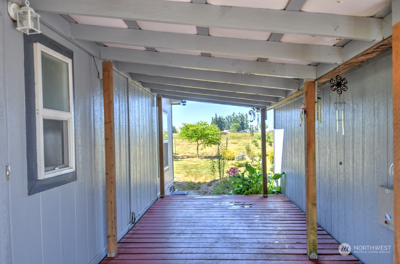 185 B Wilson Road Winlock, WA 98596 - Photo 7 of 35 a view of hallway with wooden floor and stairs