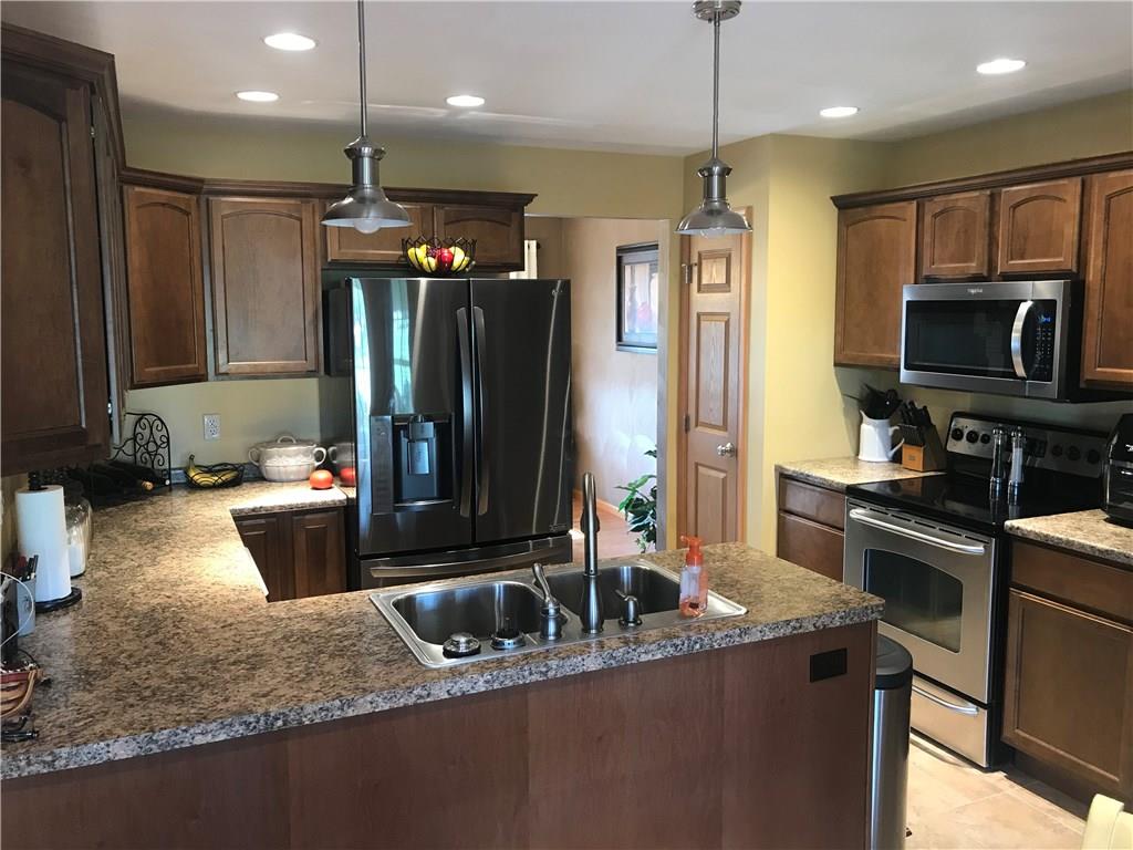 255 Huckleberry Road Indiana, PA 15701 - Photo 13 of 25 Kitchen features wrap around counter for plenty of prep and cooking with stainless steal appliances.