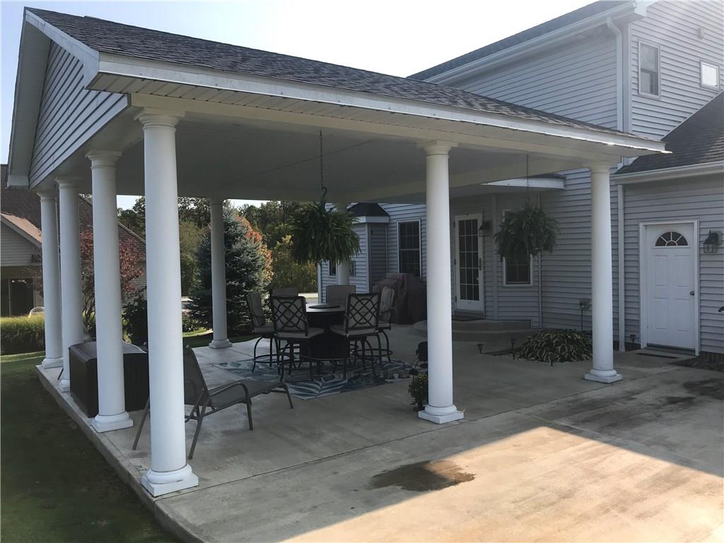 255 Huckleberry Road Indiana, PA 15701 - Photo 3 of 25 Large Plantation Covered Patio for Entertaining and Relaxing - Cemented and wrap around to side of Home.