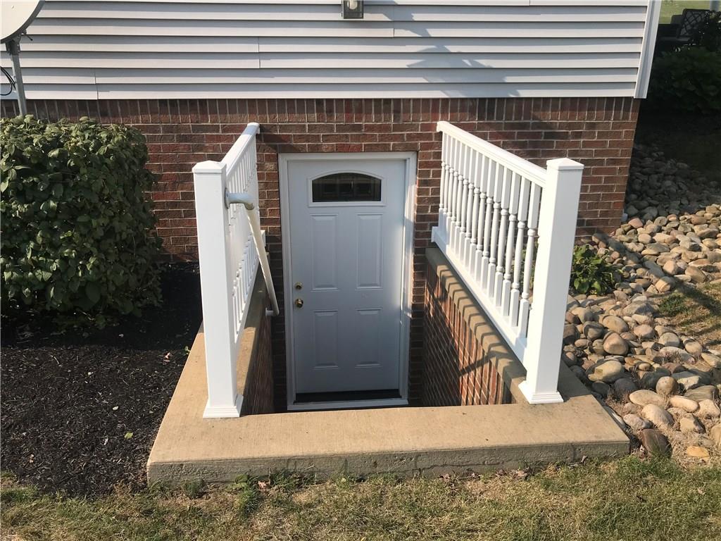 255 Huckleberry Road Indiana, PA 15701 - Photo 6 of 25 Walk Up from Basement - Brick & Concrete with PVC Fencing and Handrail - Quality