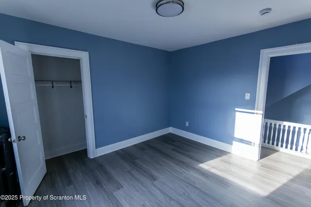 wooden floor in a hall with an entryway