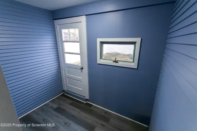 a view of entryway with wooden floor