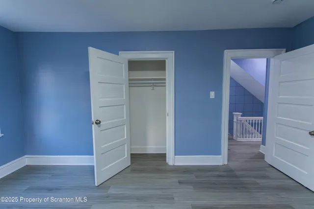 a bathroom with a sink a light fixture and a mirror