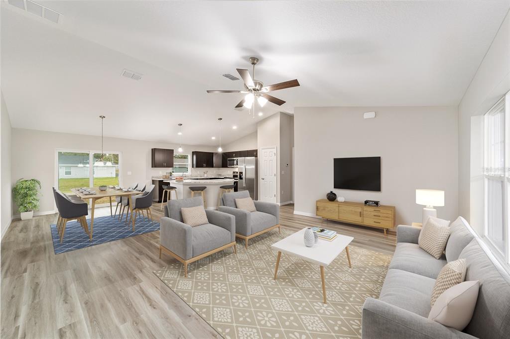 7866 North Manville Road Citrus Springs, FL 34434 - Photo 2 of 19 a living room with furniture and a flat screen tv