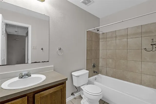 a view of a backyard with wooden fence