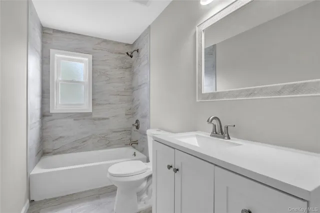 a bathroom with a sink a toilet and a bathtub