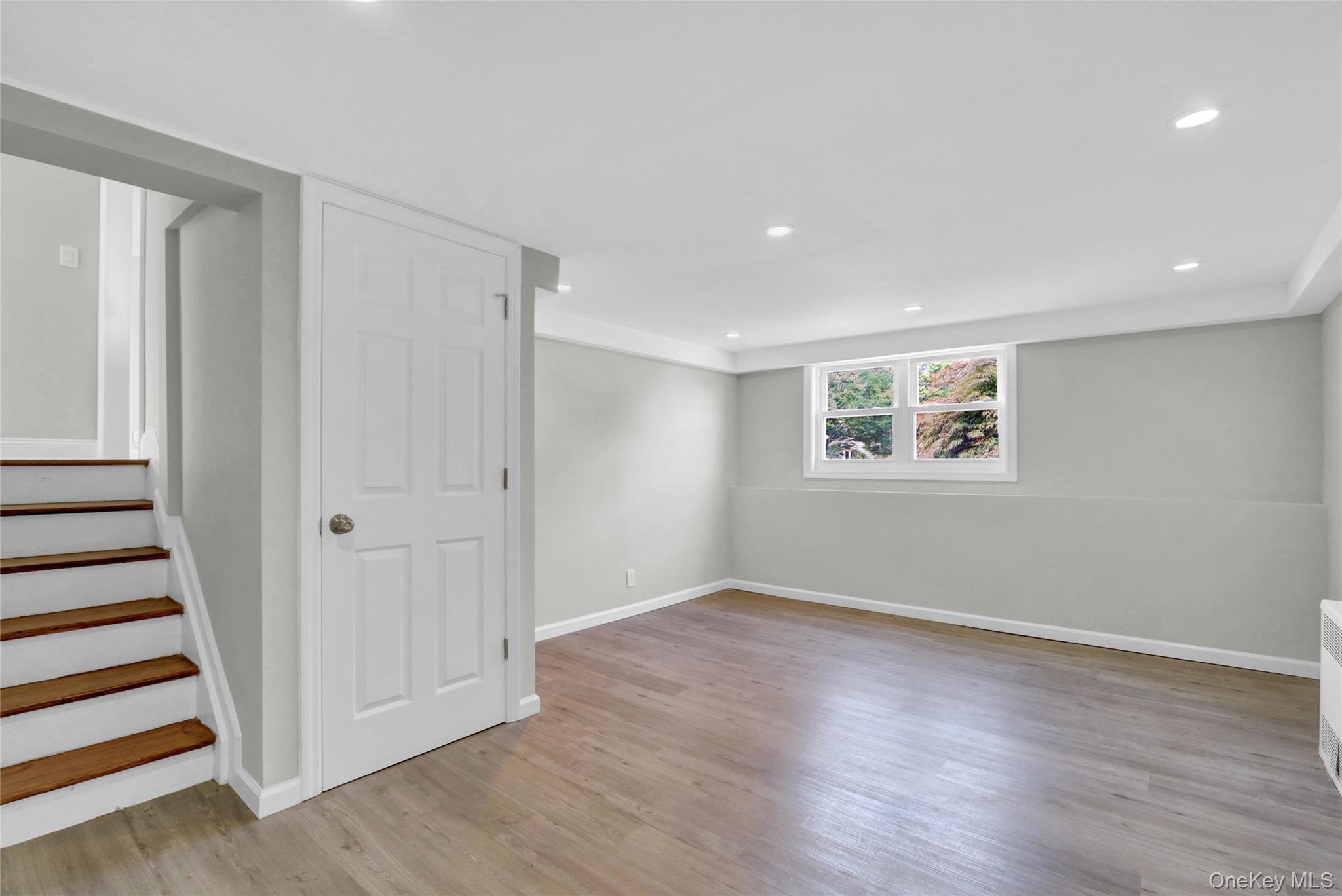 3621 Regent Lane Wantagh, NY 11793 - Photo 17 of 24 a view of a room with wooden floor and window