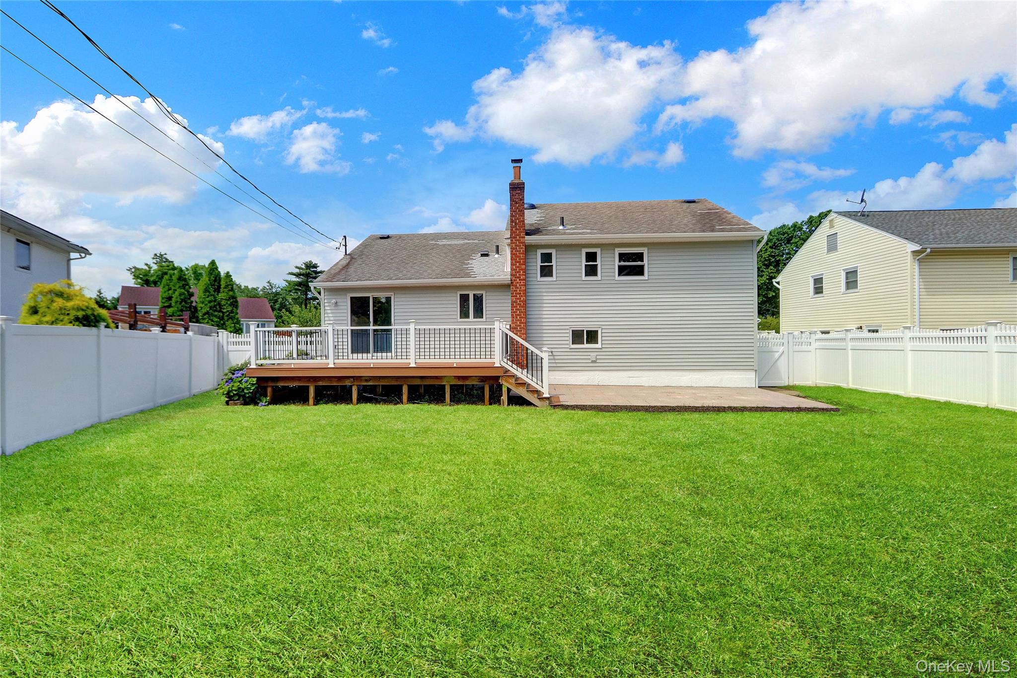 3621 Regent Lane Wantagh, NY 11793 - Photo 22 of 24 a front view of a house with a yard