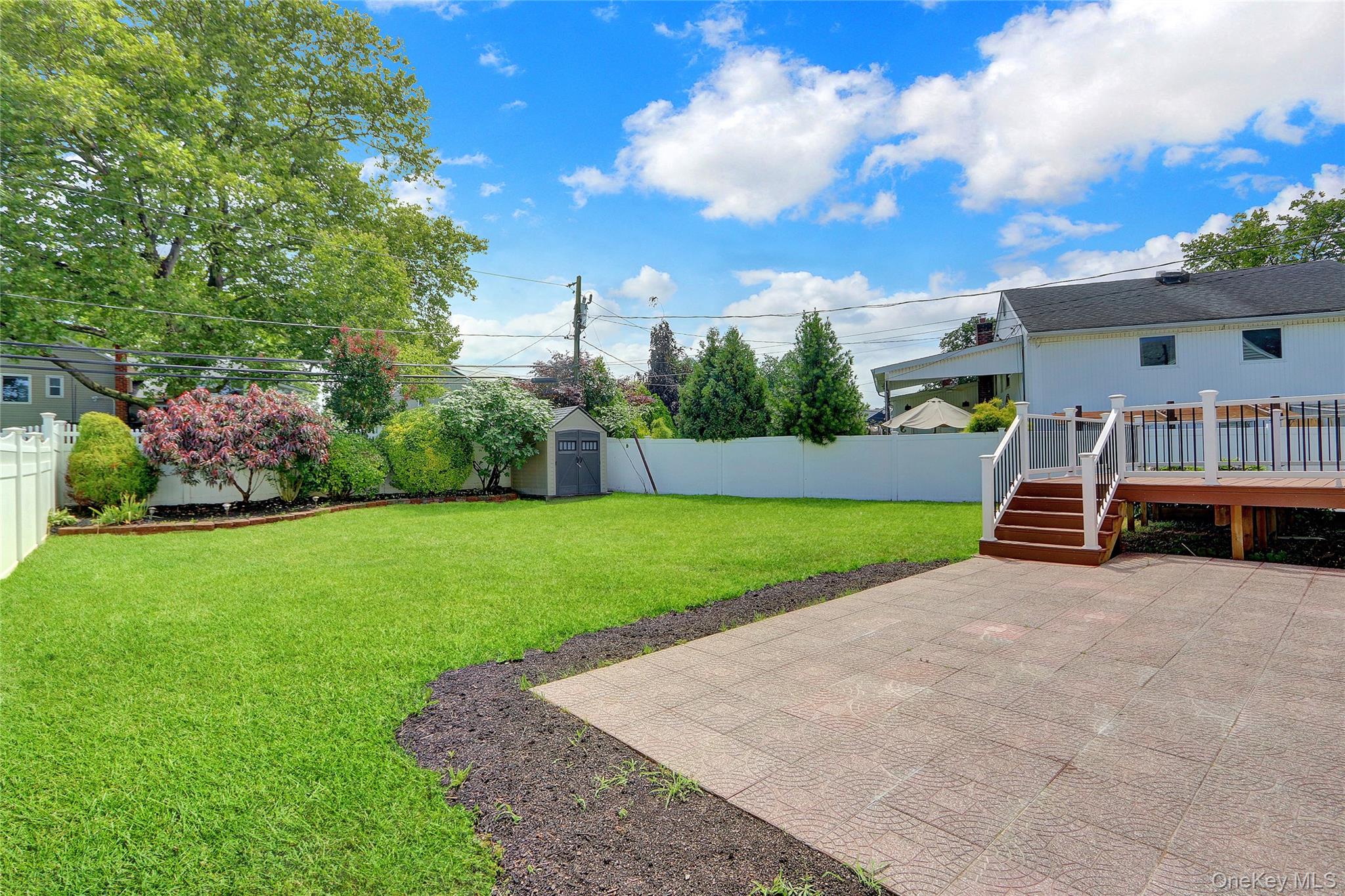 3621 Regent Lane Wantagh, NY 11793 - Photo 24 of 24 a view of a house with a big yard