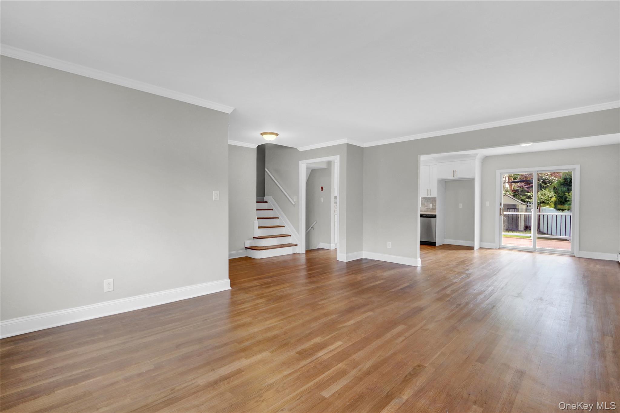 3621 Regent Lane Wantagh, NY 11793 - Photo 5 of 24 a view of an empty room with wooden floor and window