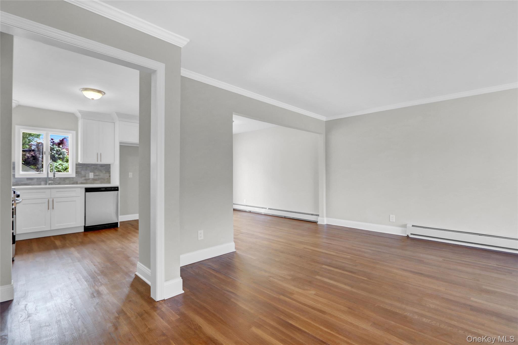 3621 Regent Lane Wantagh, NY 11793 - Photo 7 of 24 a view of a kitchen with wooden floor and a sink