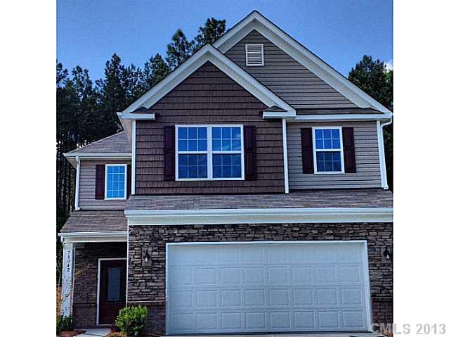 78042 Rillstone Drive Lancaster, SC 29720 - Photo 2 of 4 a front view of a house with garage