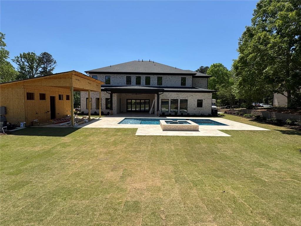 3425 Thompson Mill Road Buford, GA 30519 - Photo 19 of 48 a swimming pool view with a seating space and a garden view