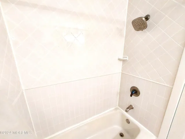 a kitchen with stainless steel appliances a refrigerator a stove a microwave and cabinets