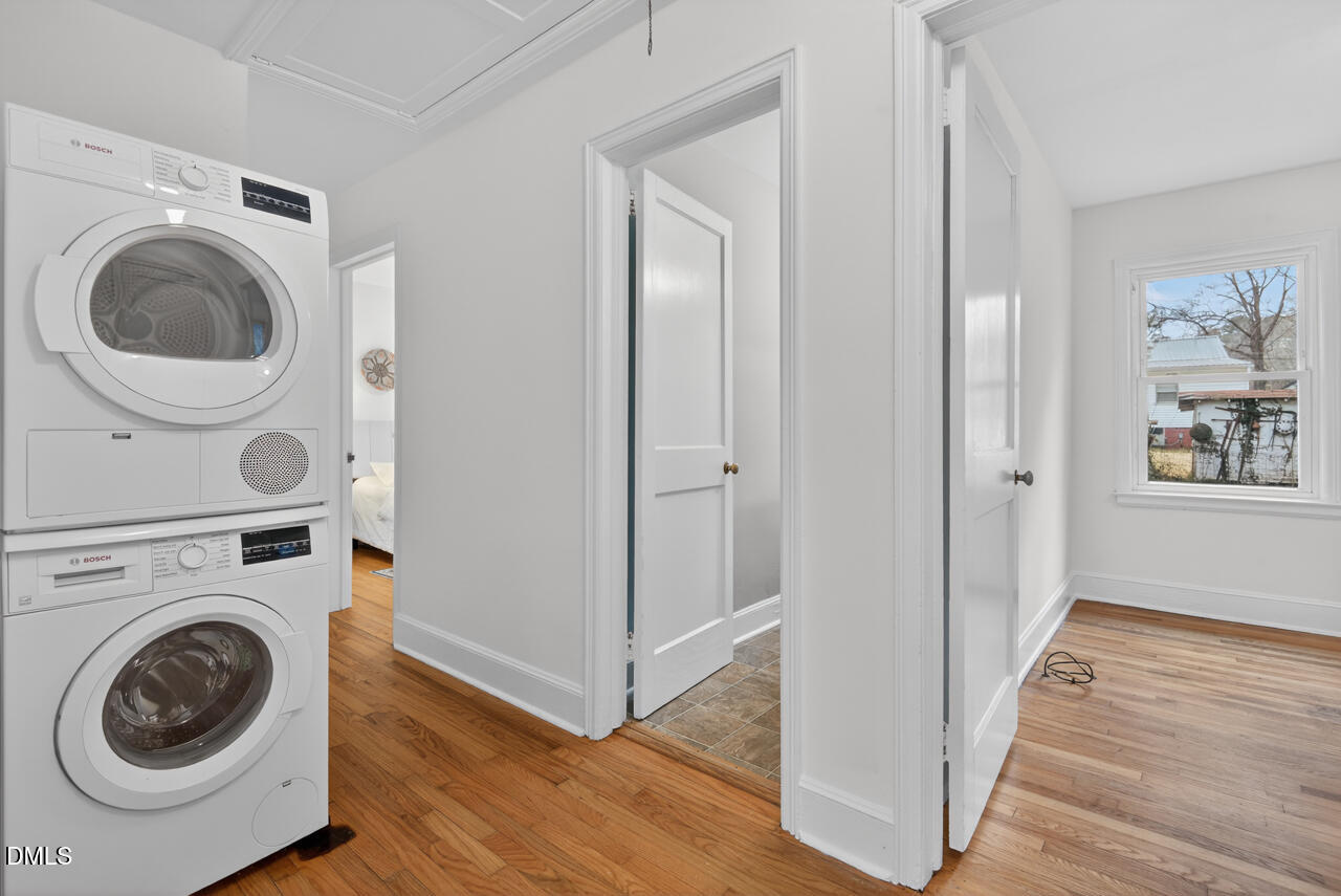 1811 Forest Road Durham, NC 27705 - Photo 14 of 26 a view of a hallway with washer and dryer