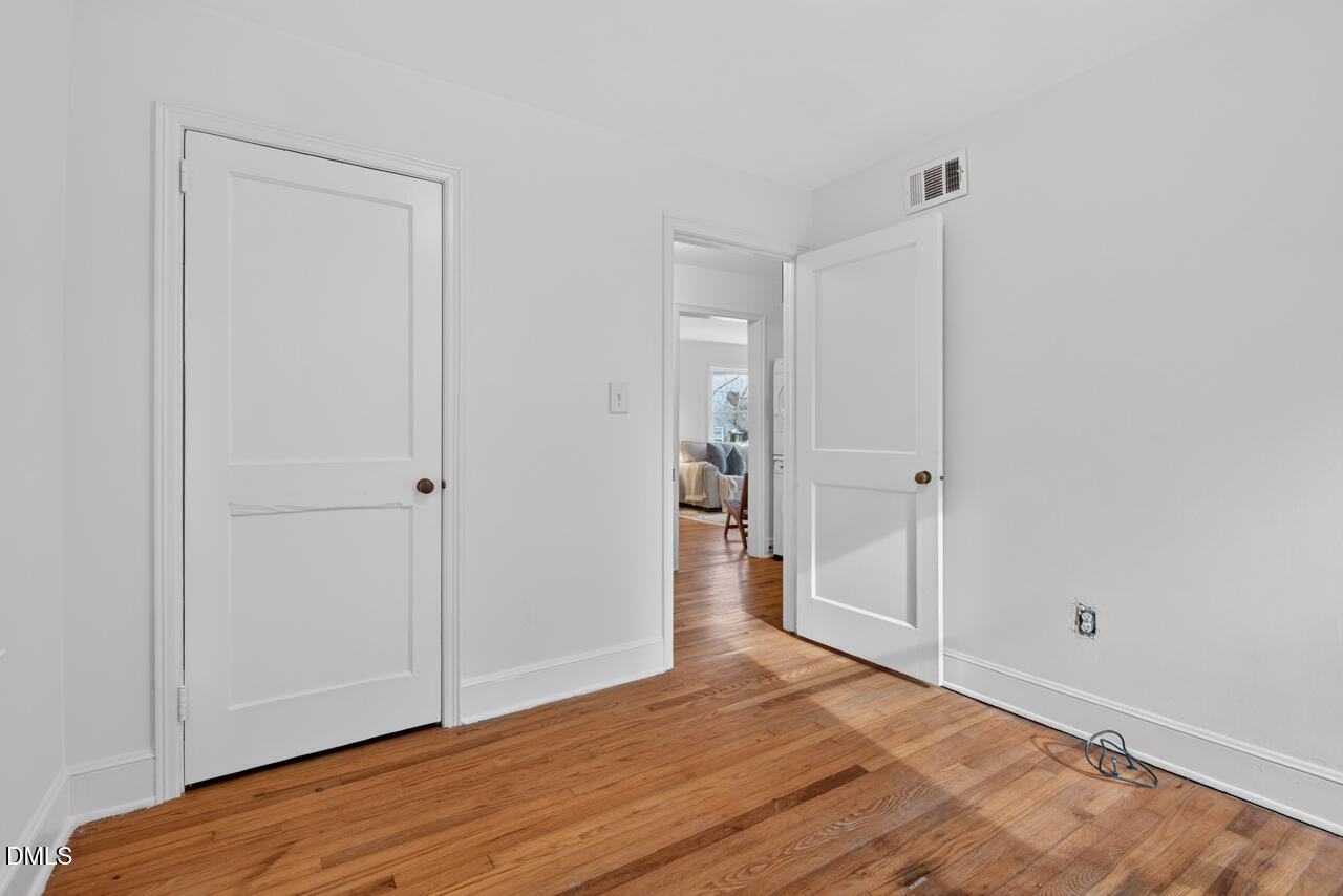 1811 Forest Road Durham, NC 27705 - Photo 18 of 26 a view of empty room with wooden floor