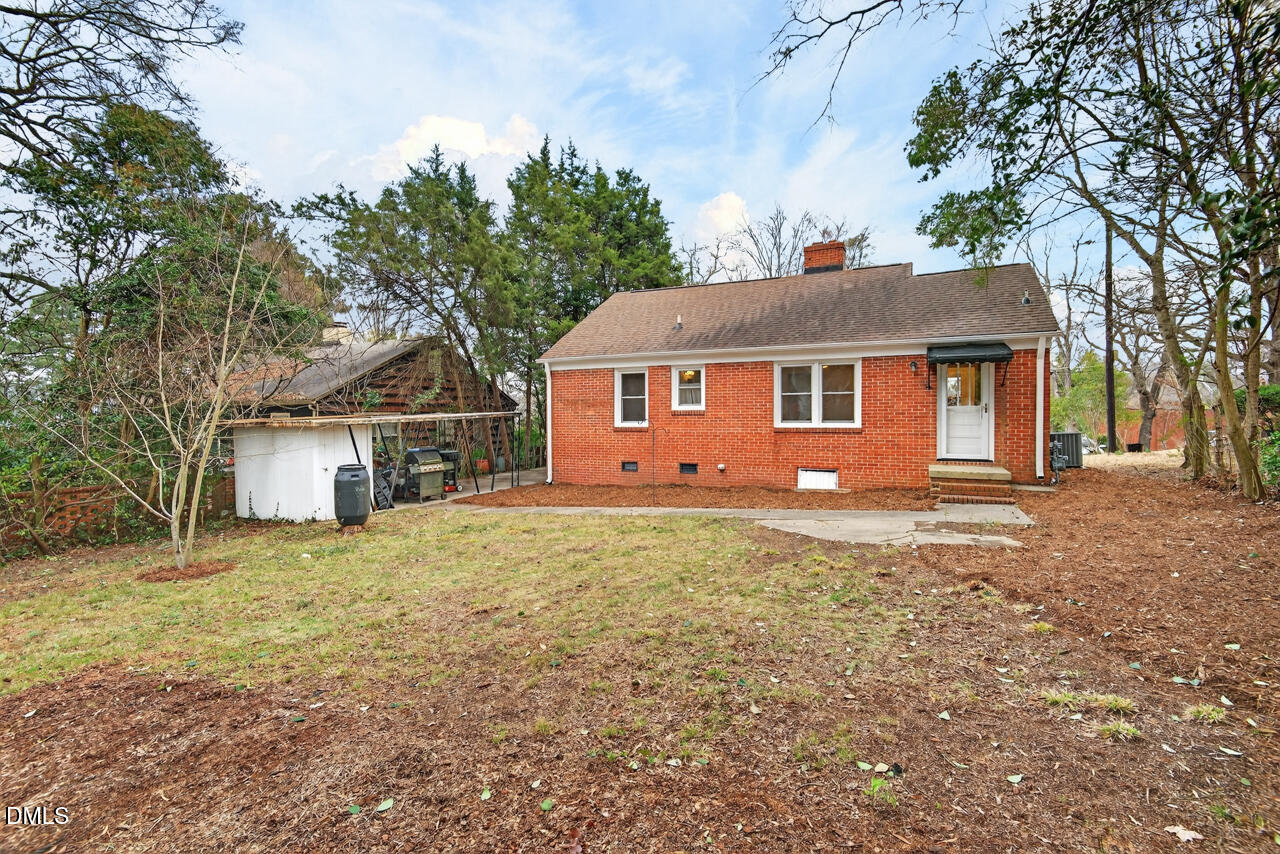 1811 Forest Road Durham, NC 27705 - Photo 22 of 26 a front view of a house with a yard
