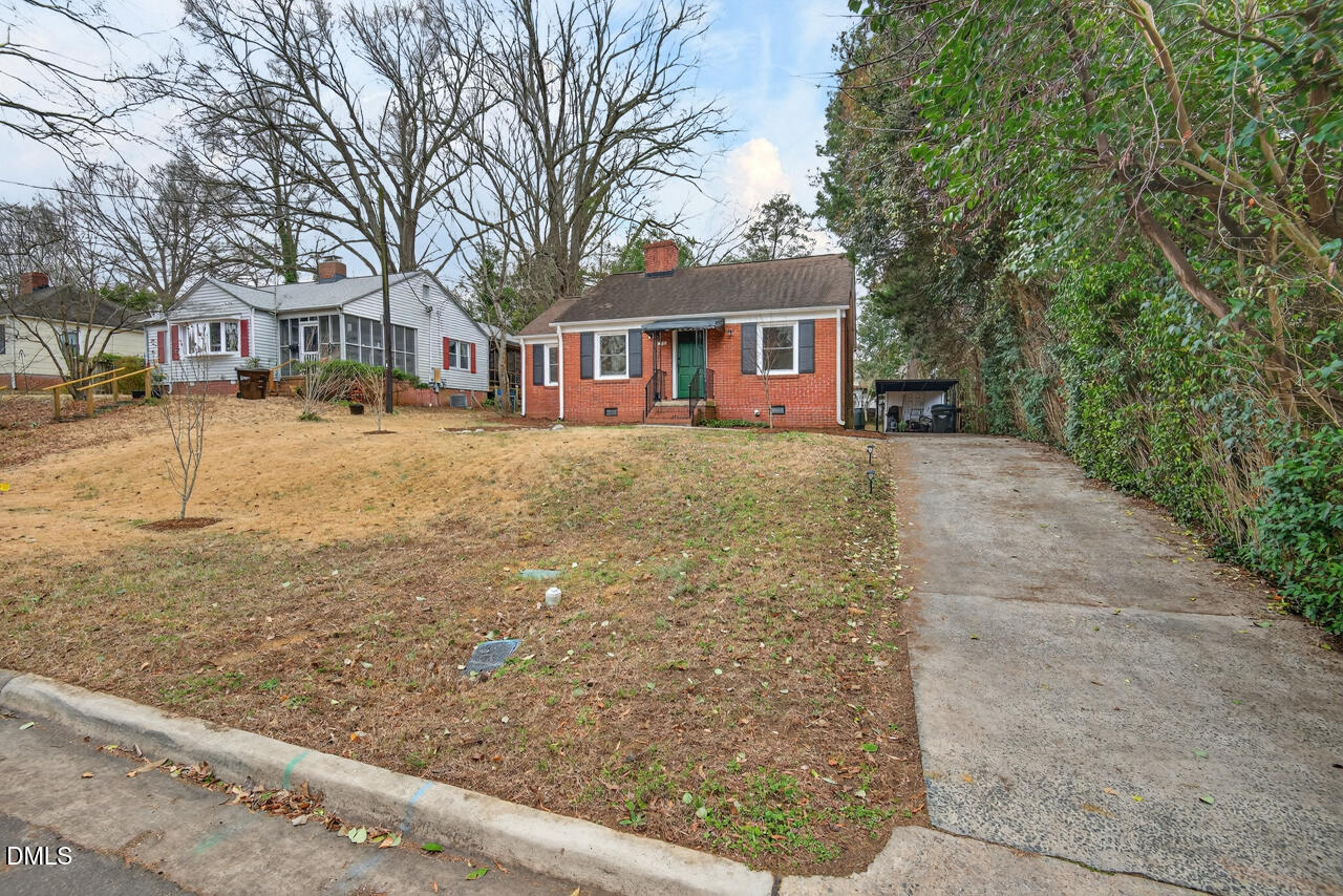 1811 Forest Road Durham, NC 27705 - Photo 25 of 26 a front view of a house with a yard