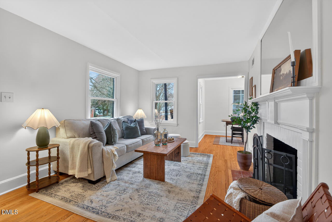 1811 Forest Road Durham, NC 27705 - Photo 5 of 26 a living room with furniture fireplace and a window