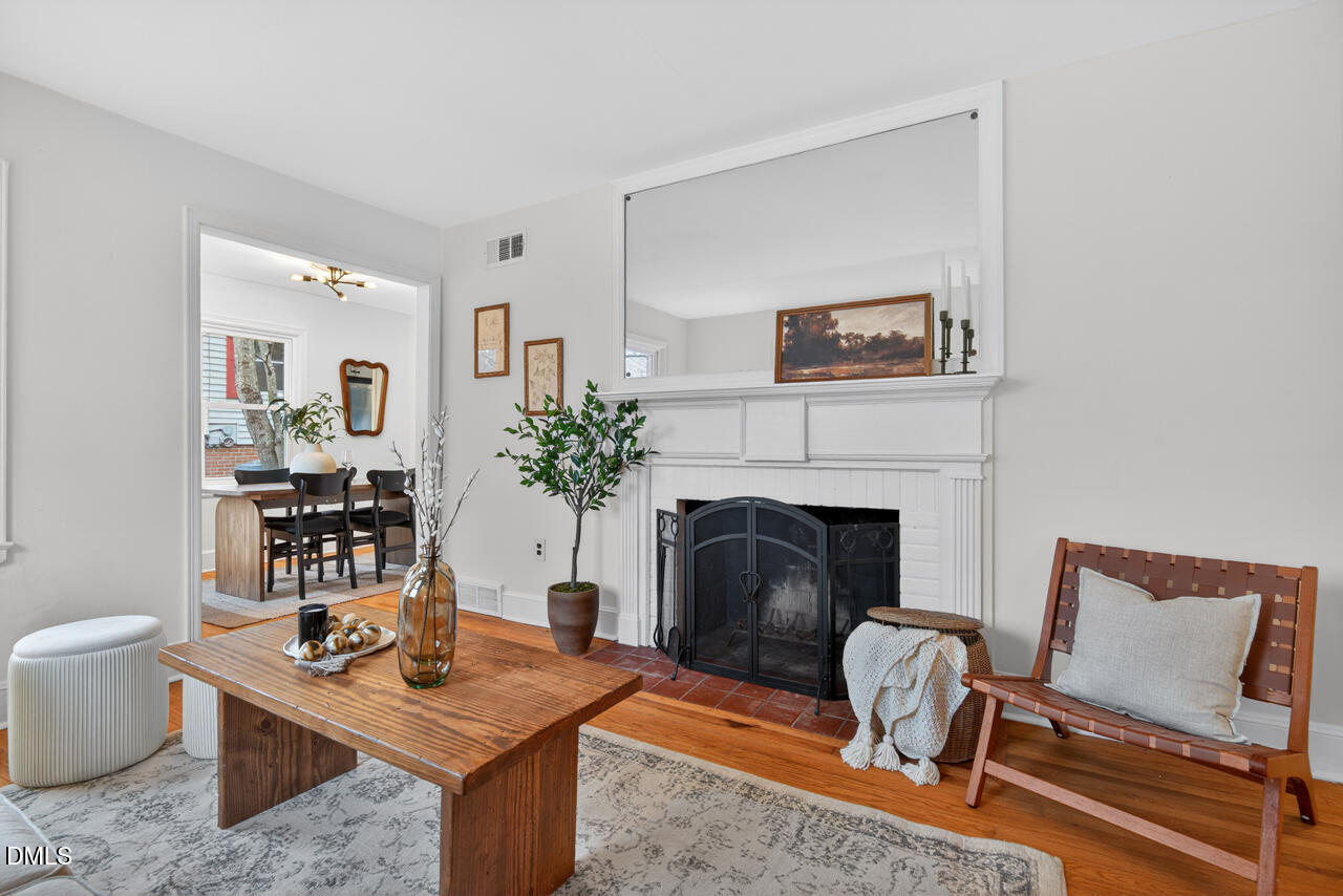 1811 Forest Road Durham, NC 27705 - Photo 6 of 26 a living room with furniture and a fireplace