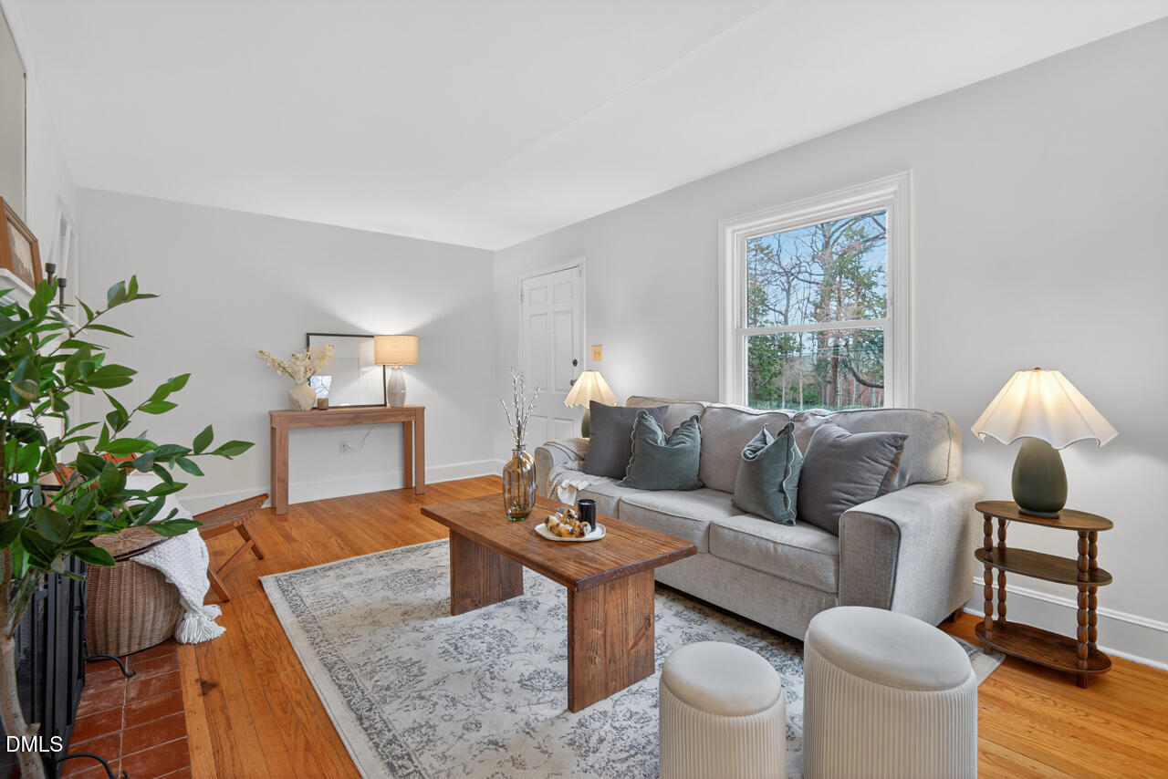 1811 Forest Road Durham, NC 27705 - Photo 7 of 26 a living room with furniture and a potted plant