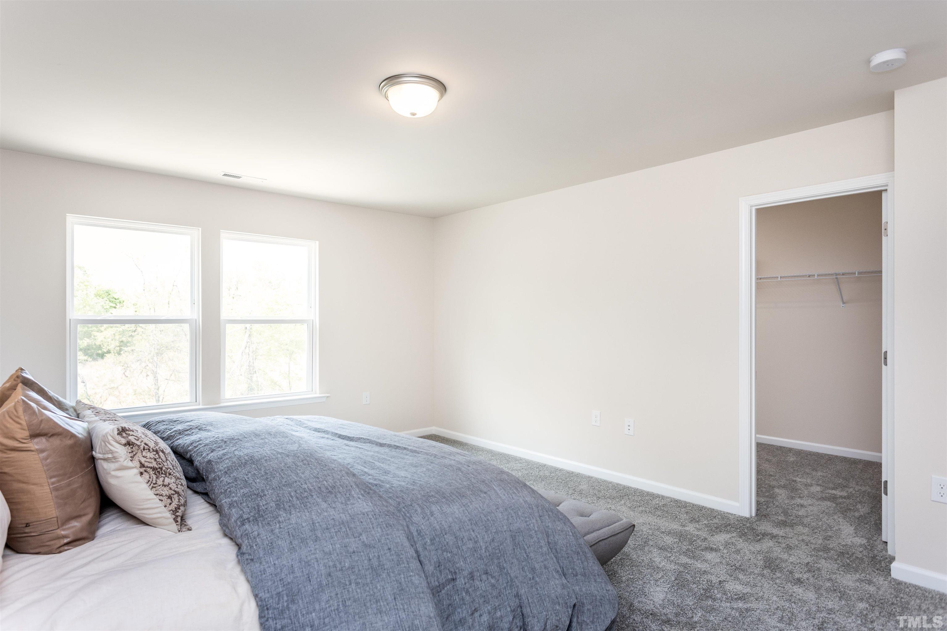 4900 Megara Run, Unit ROYAL Raleigh, NC 27603 - Photo 14 of 22 a bedroom with a bed and a window