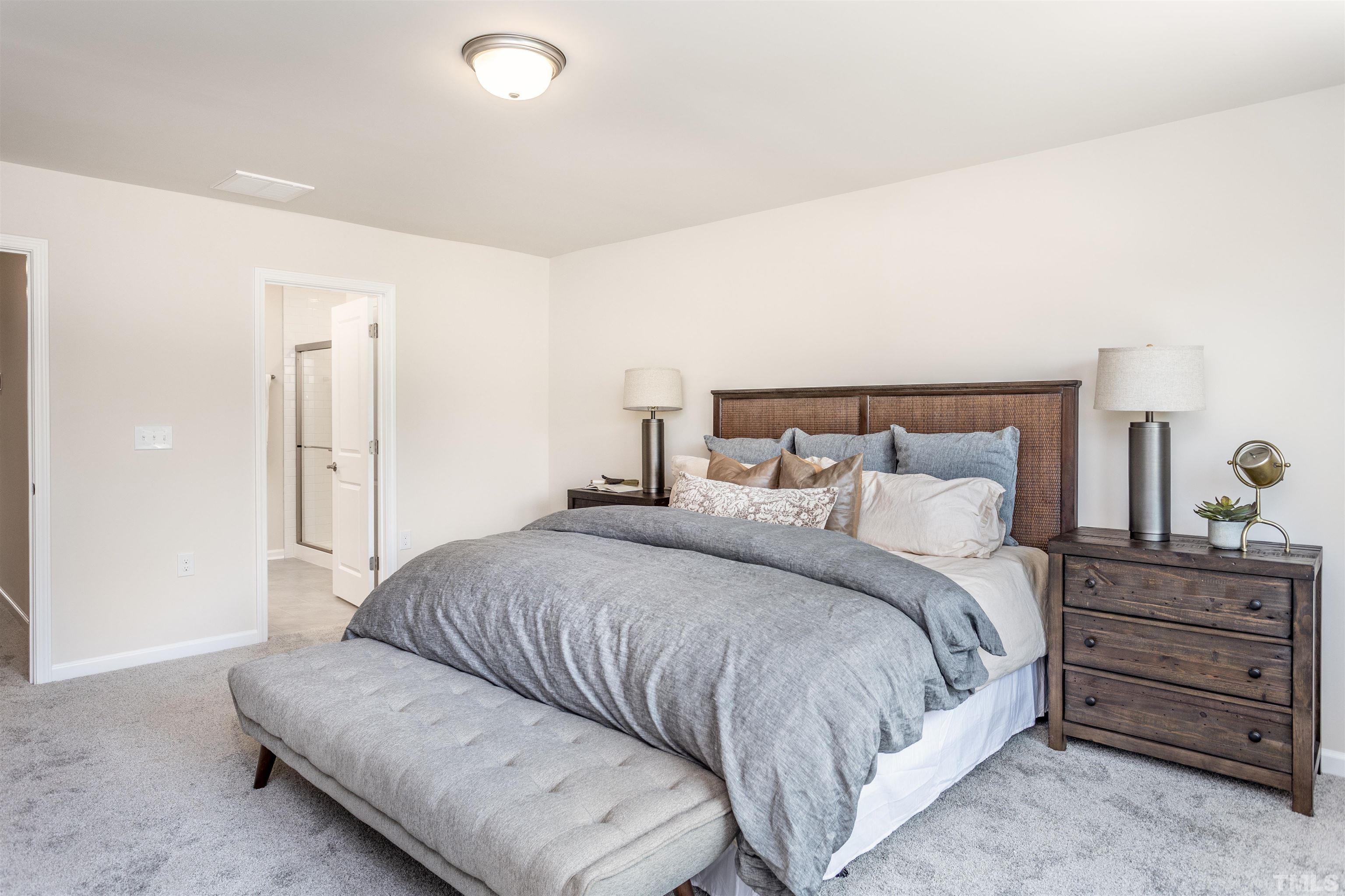 4900 Megara Run, Unit ROYAL Raleigh, NC 27603 - Photo 15 of 22 a bedroom with a bed and with furniture