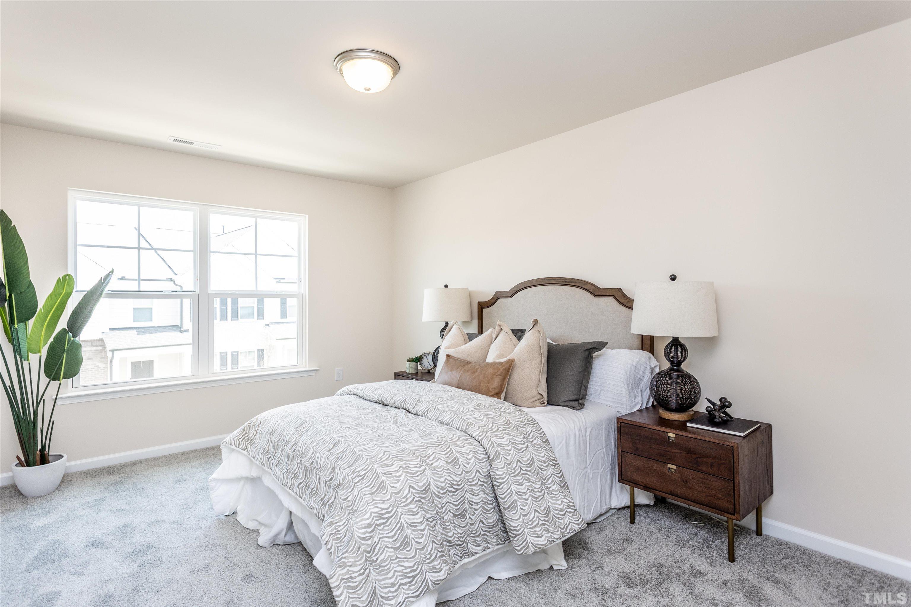 4900 Megara Run, Unit ROYAL Raleigh, NC 27603 - Photo 18 of 22 a bedroom with a bed and a window