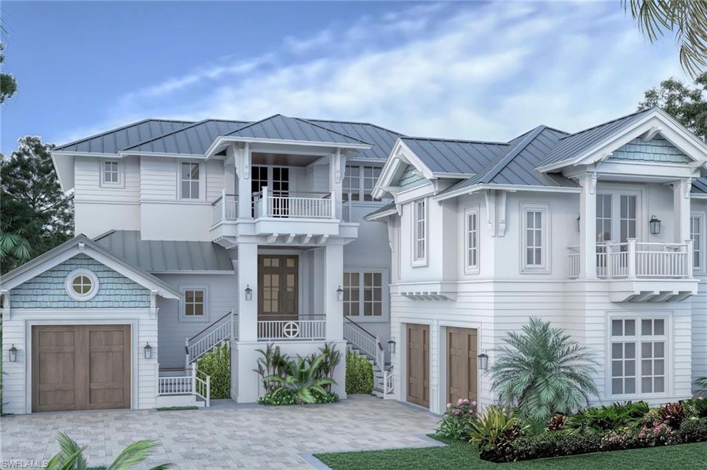3295 Gordon Drive Naples, FL 34102 - Photo 1 of 4 a front view of a house with a garden and garage