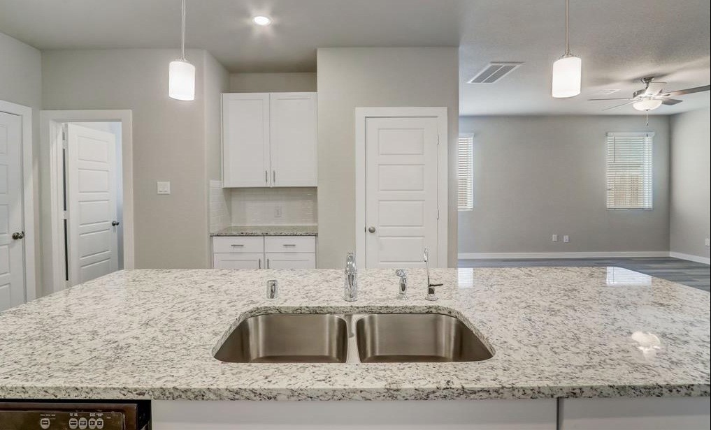 8403 Arden Valley Lane Houston, TX 77063 - Photo 13 of 32 a kitchen with granite countertop a sink and a granite counter tops